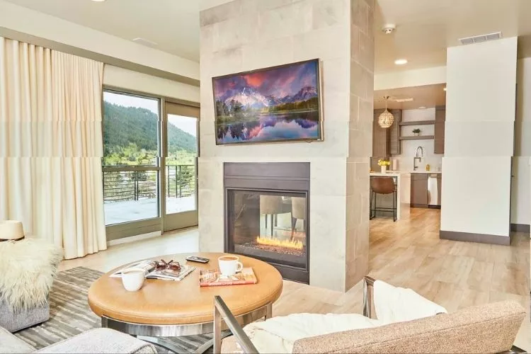 A two-way fireplace in a living room at a residence in Teton Village, WY.