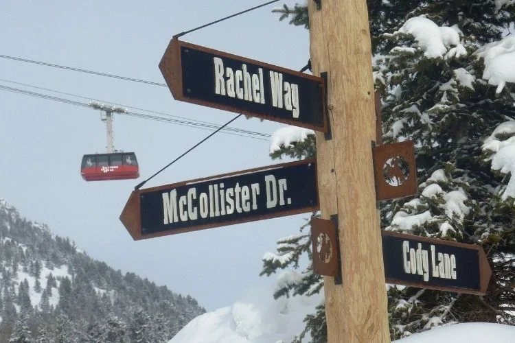 A three-way street sign in Teton Village, WY.