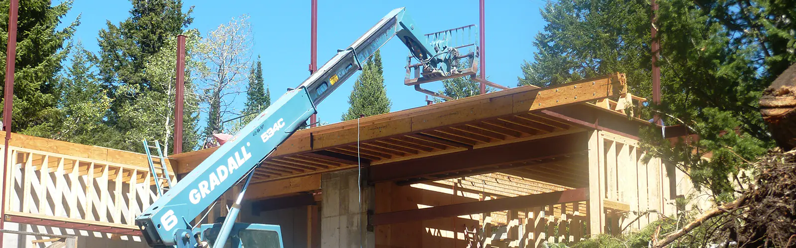 A forklift working on a residence in Teton Village, WY.