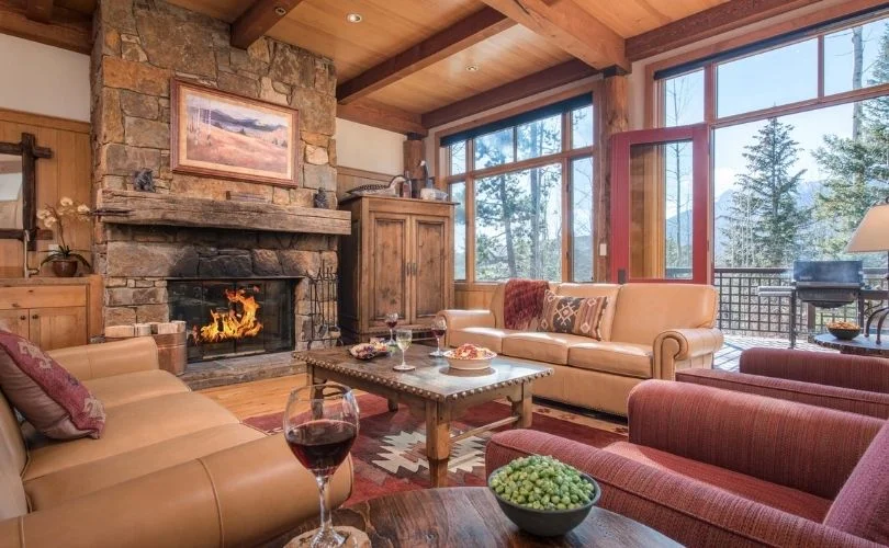 A living room with a fireplace at a residence in Teton Village, WY.