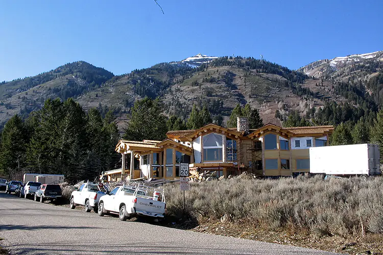 A residence under construction on a hillside in Teton Village, WY.